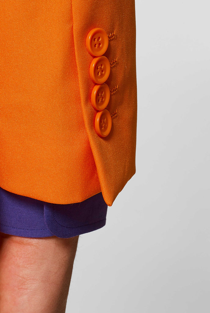 Man wearing orange men's suit with purple dress shirt, sleeve close up