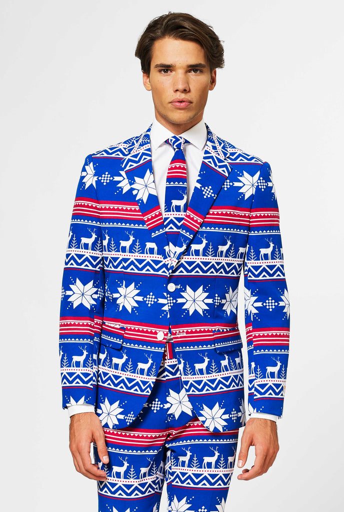 Man wearing blue Christmas suit with Nordic themed print