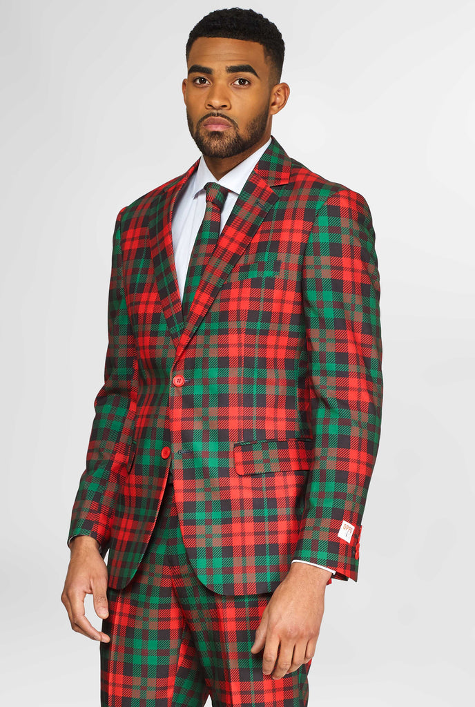 Green and red tartan Christmas suit worn by man