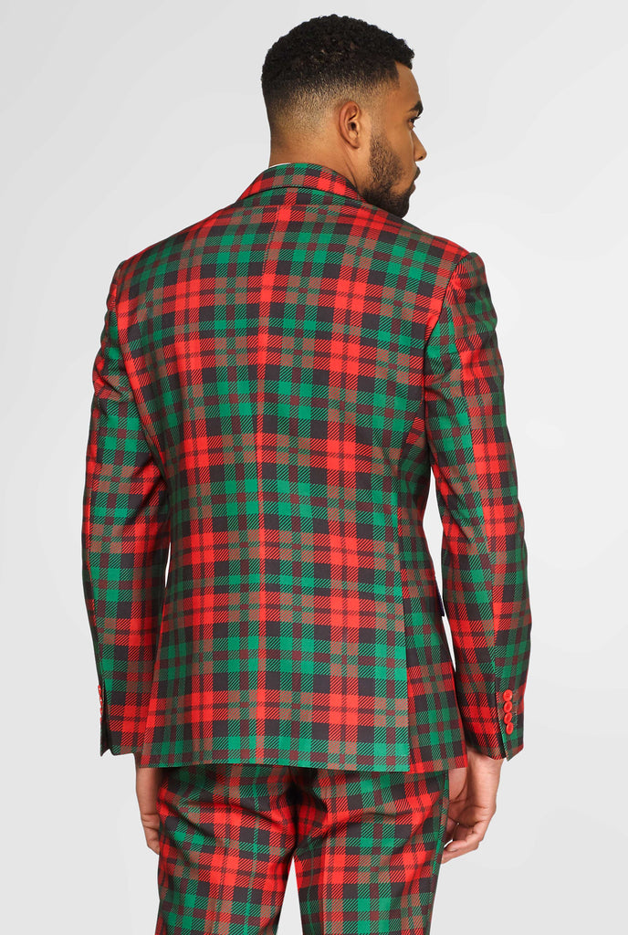 Green and red tartan Christmas men's suit worn by man, view from the back