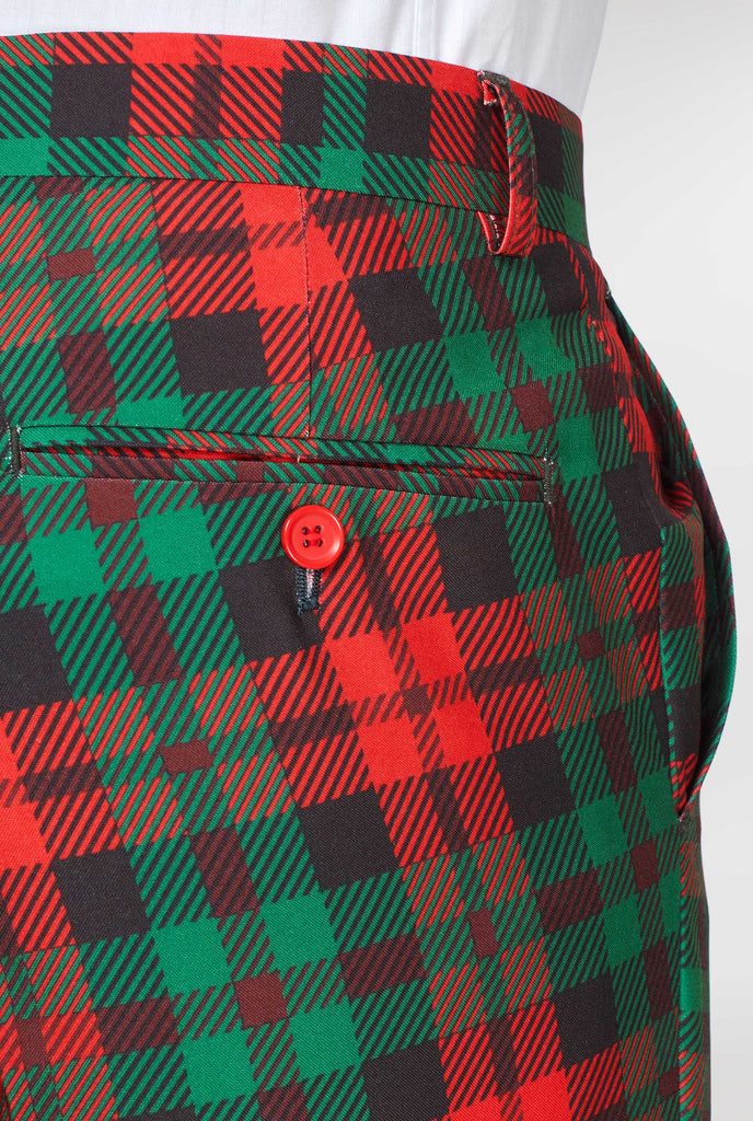 Back of green and red tartan suit pants worn by man