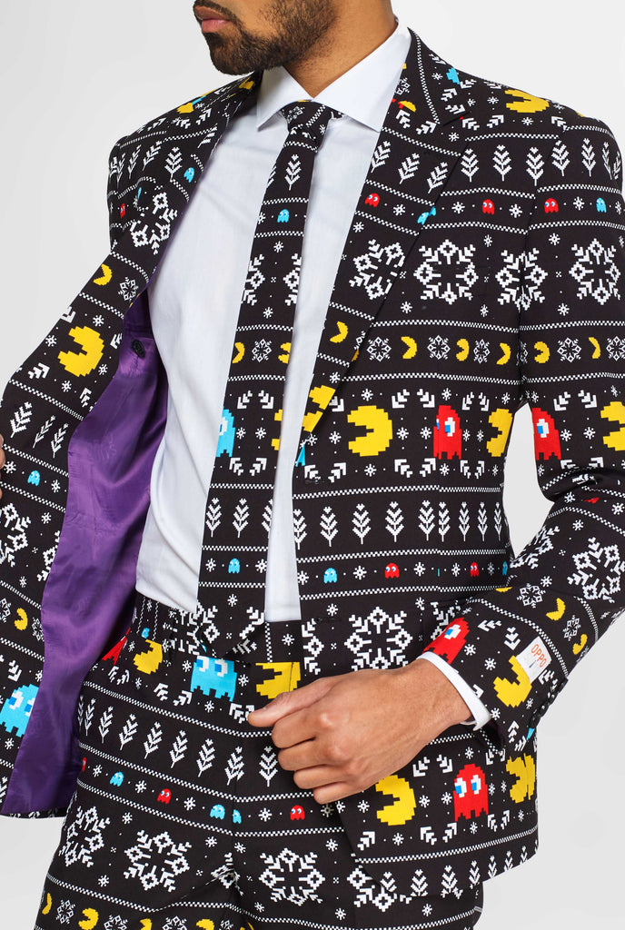 Pac-Man suit with Christmas theme worn by man showing inside of jacket