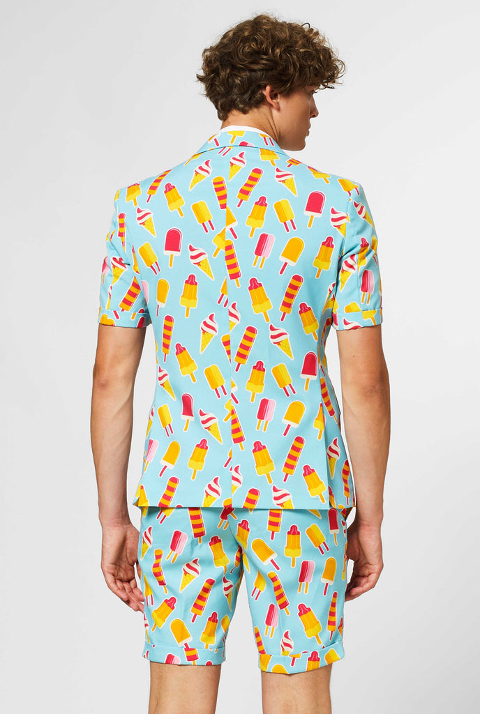 Man wearing light blue summer suit with popsicle print, view from the back