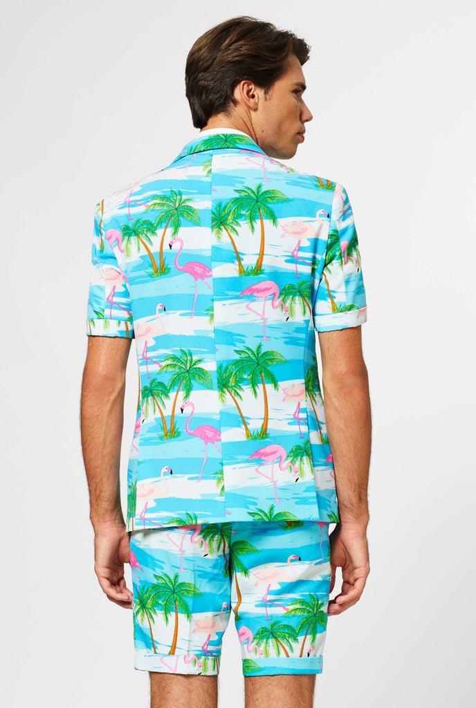 Man wearing summer suit with tropical flamingo print, view from the back