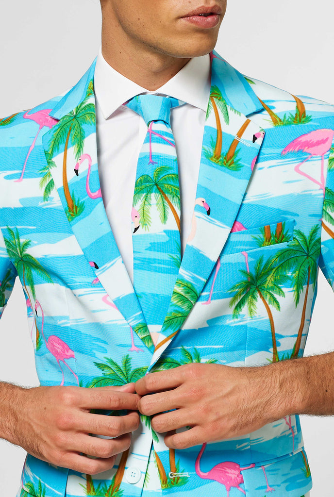 Man wearing summer suit with tropical flamingo print, close up