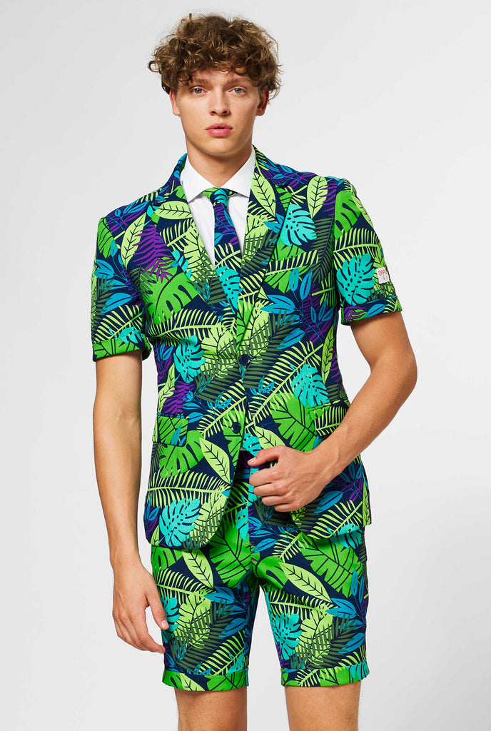 Man wearing green summer suit with jungle leaf print