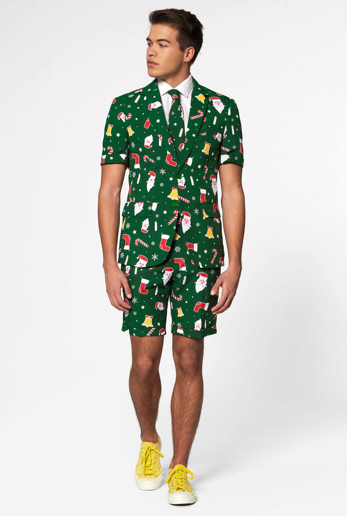 Man wearing green Christmas summer suit, consisting of shorts, jacket and tie