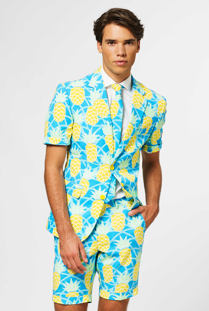 Man wearing blue summer suit with pineapple print