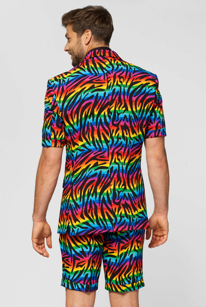 Man wearing summer suit with rainbow zebra stripes print, view from the back