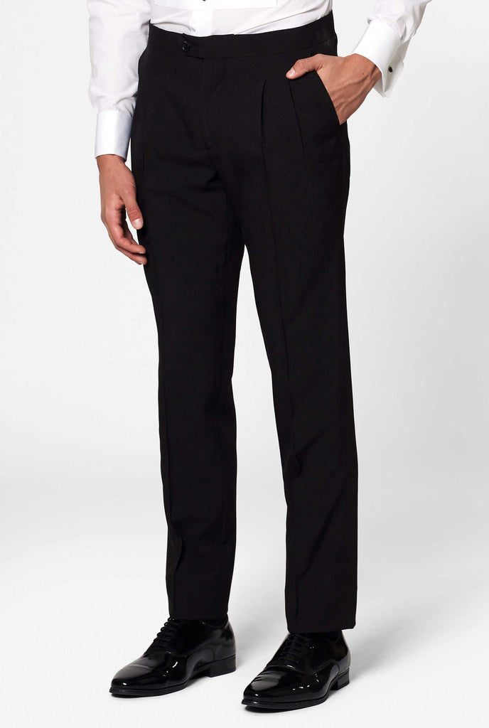 Solid black tuxedo suit Jet Set Black worn by man pants