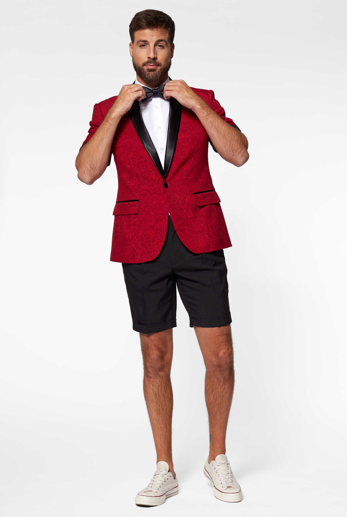 Man wearing red summer tuxedo with flower print