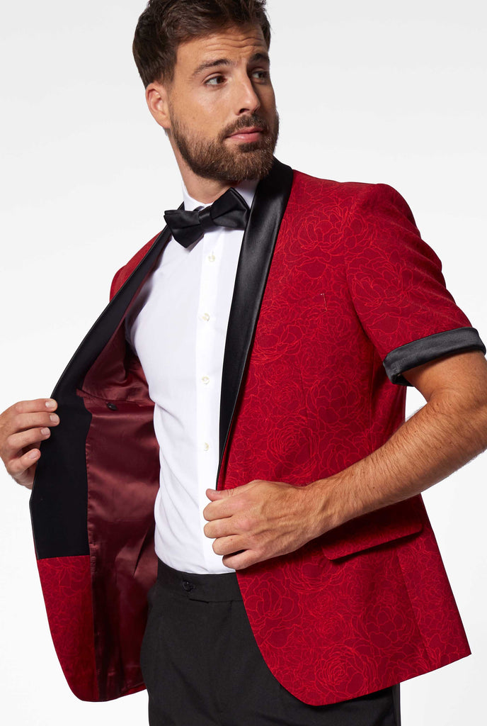 Man wearing red summer tuxedo with flower print