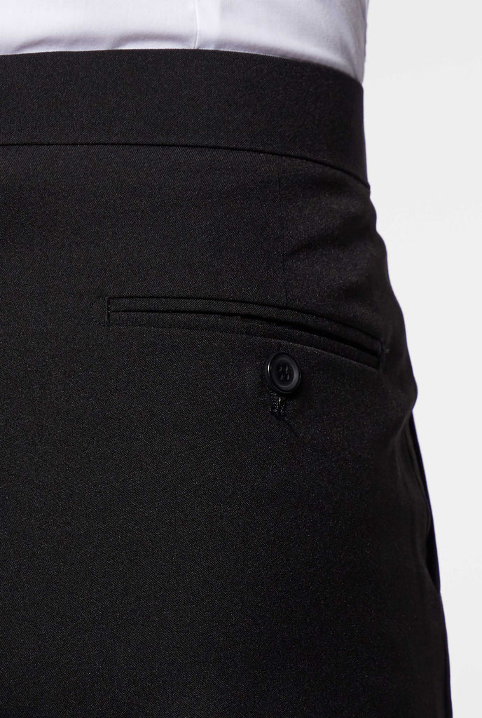 Man wearing black shorts part of summer tuxedo close up