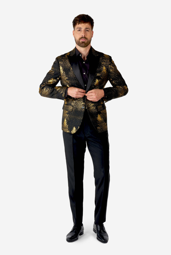 Man wearing black blazer with golden Christmas tree print