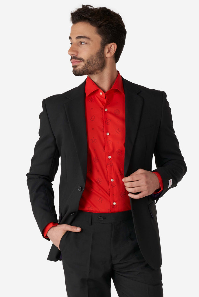 Man wearing red dress shirt with Christmas icons