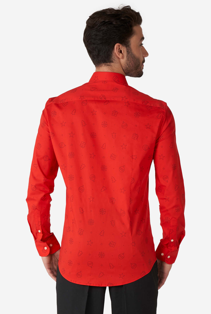 Man wearing red dress shirt with Christmas icons, view from the back