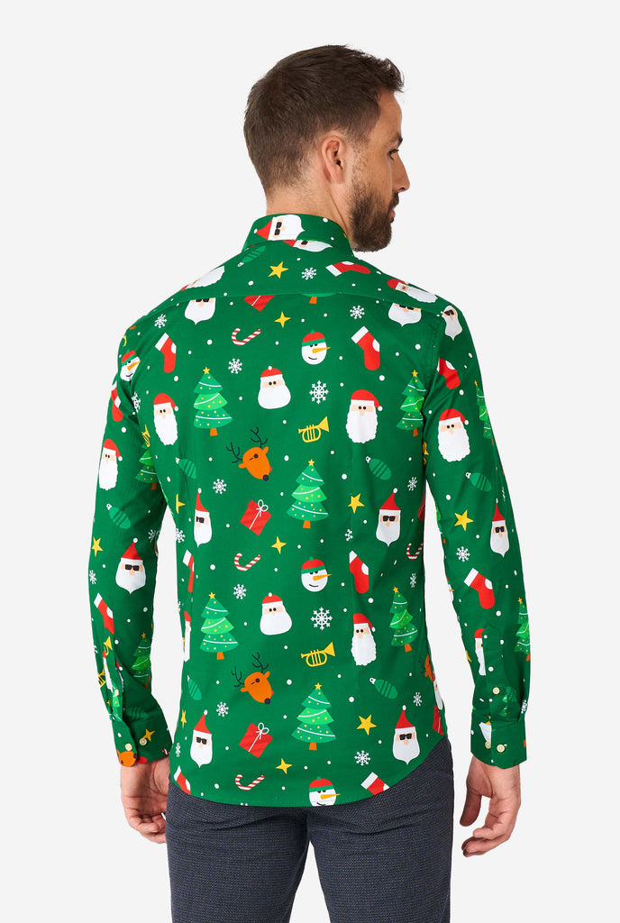 Man wearing green Christmas dress shirt with Christmas icons, close up