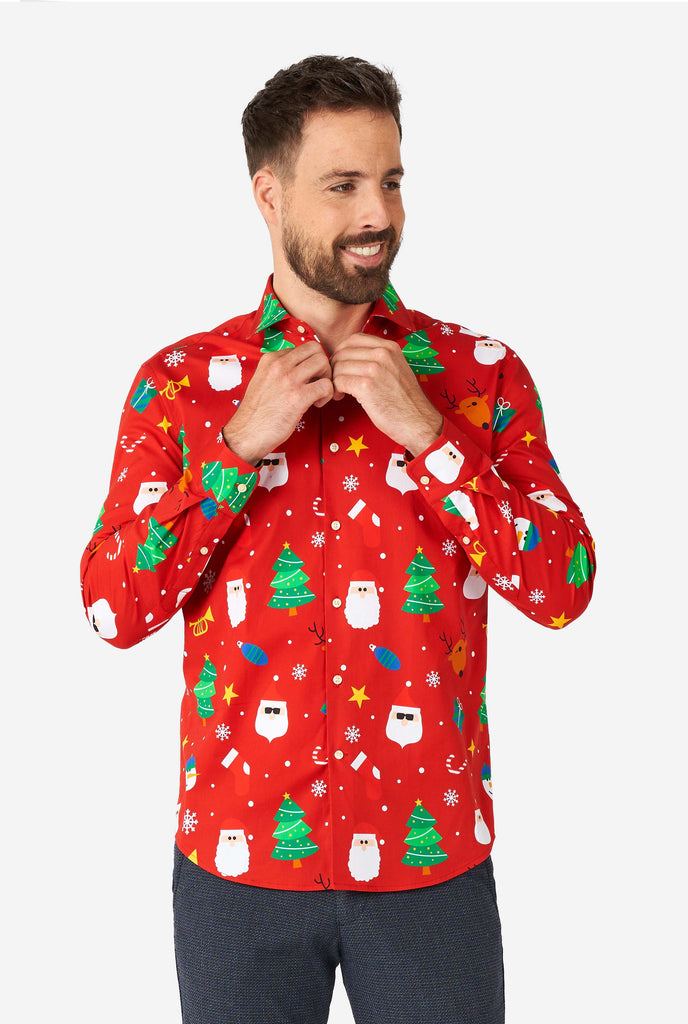 Man wearing red Christmas dress shirt with Christmas icons