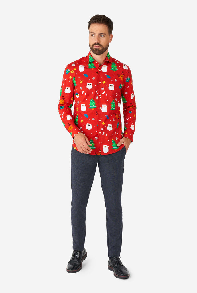 Man wearing red Christmas dress shirt with Christmas icons