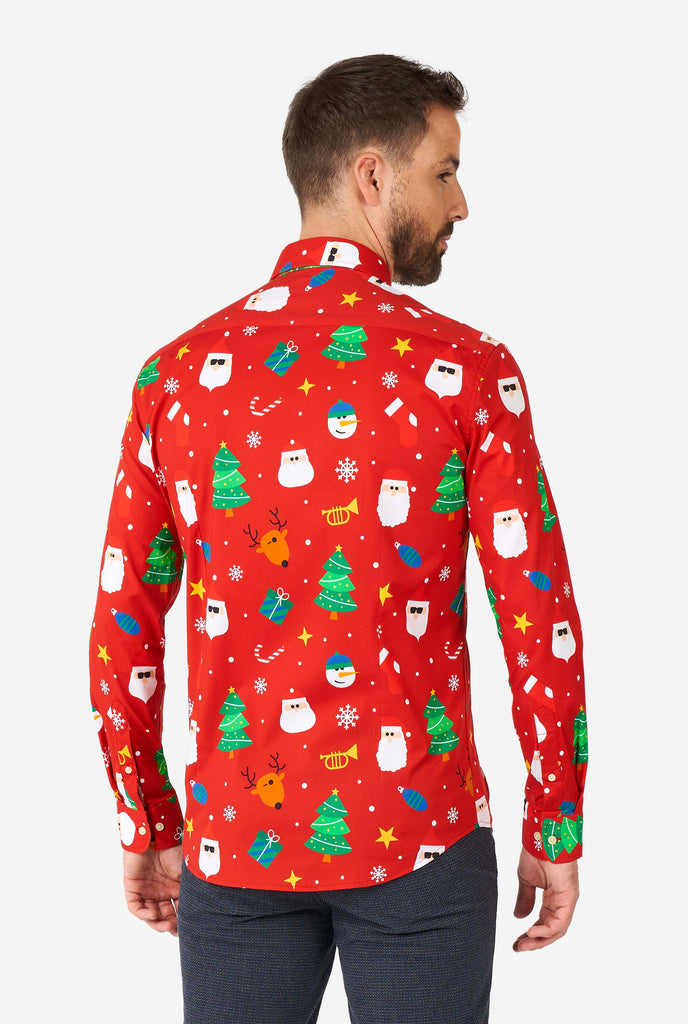 Man wearing red Christmas dress shirt with Christmas icons, view from the back