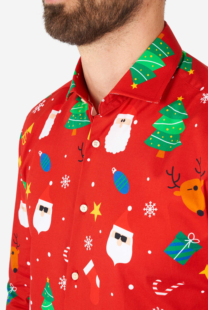 Man wearing red Christmas dress shirt with Christmas icons, close up