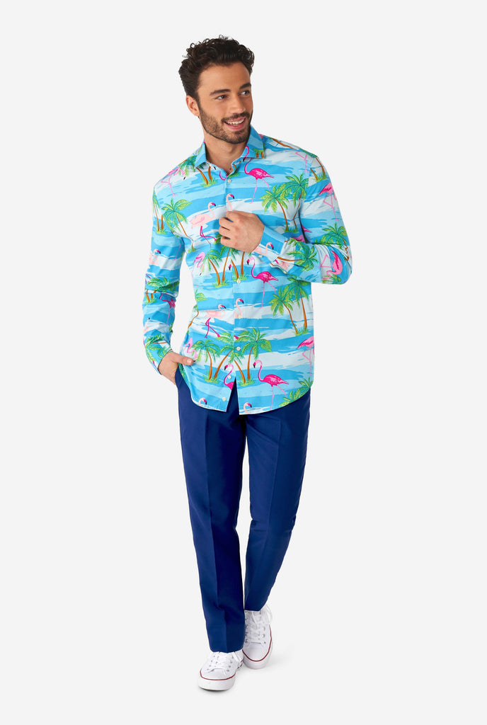 Man wearing Hawaiian dress shirt with tropical flamingo print