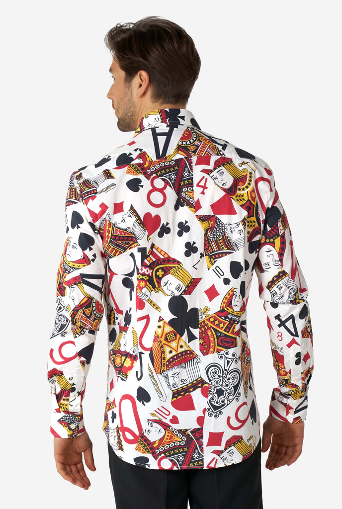 Man wearing dress shirt with playing card print, vie from the back