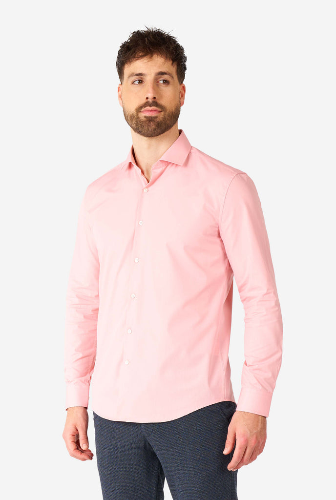 Man wearing soft pink dress shirt