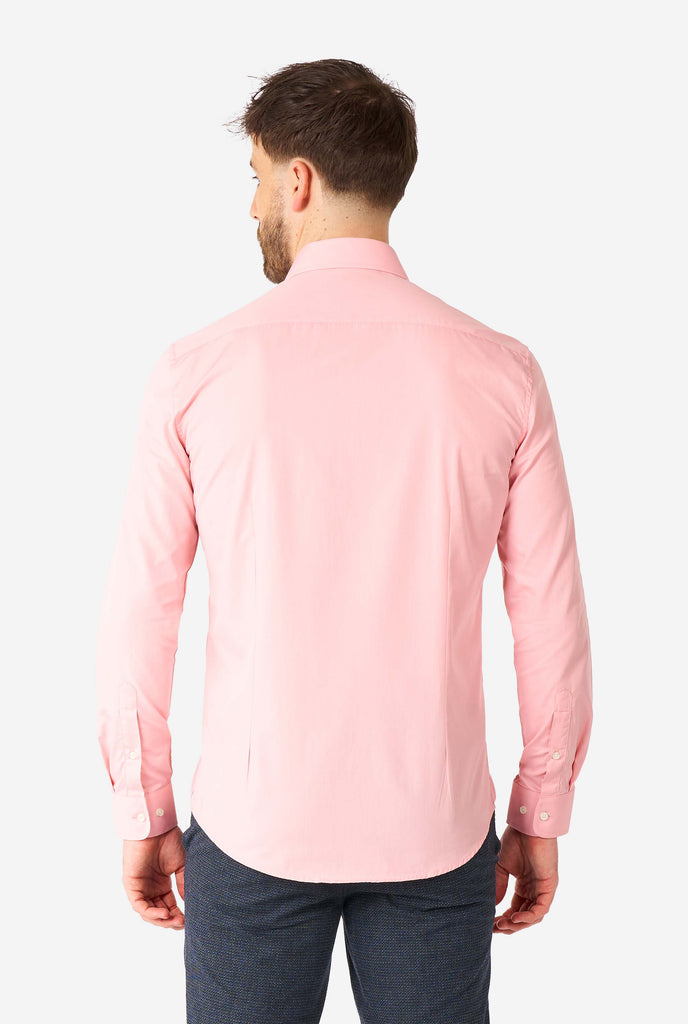 Man wearing soft pink dress shirt, view from the back