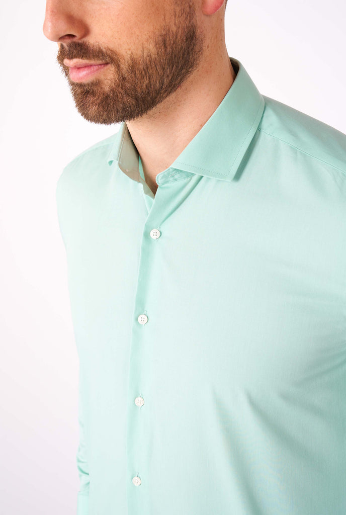 Man wearing mint green dress shirt, close up