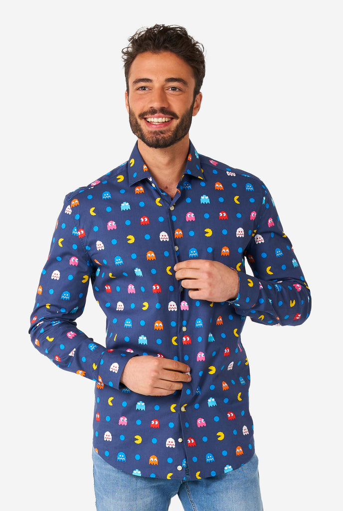 Man wearing blue dress shirt with Pac-Man icons