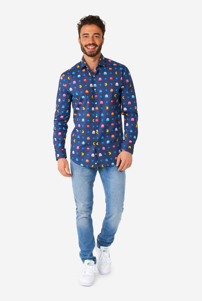 Man wearing blue dress shirt with Pac Man icons