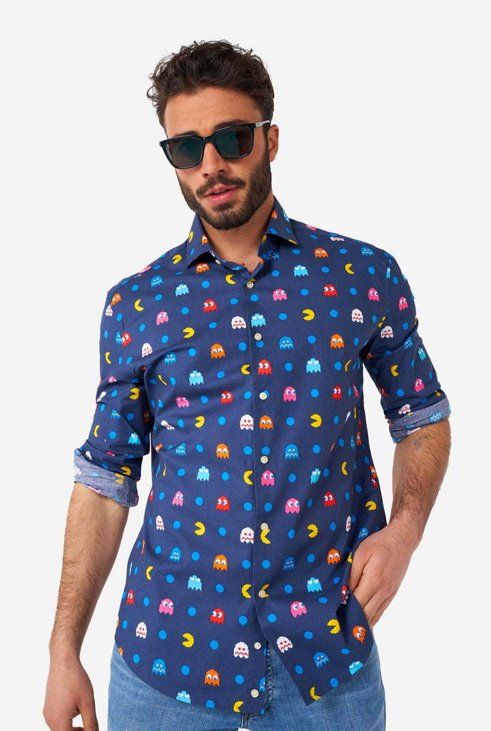 Man wearing blue dress shirt with Pac-Man icons