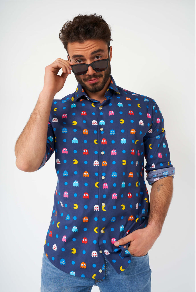 Man wearing blue dress shirt with Pac Man icons