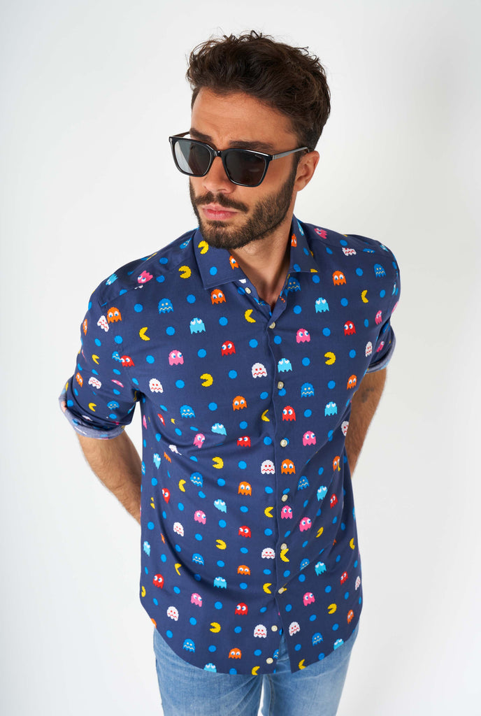 Man wearing blue dress shirt with Pac-Man icons