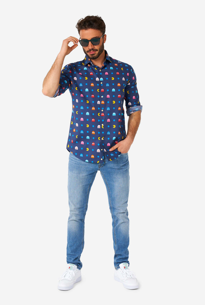 Man wearing blue dress shirt with Pac-Man icons