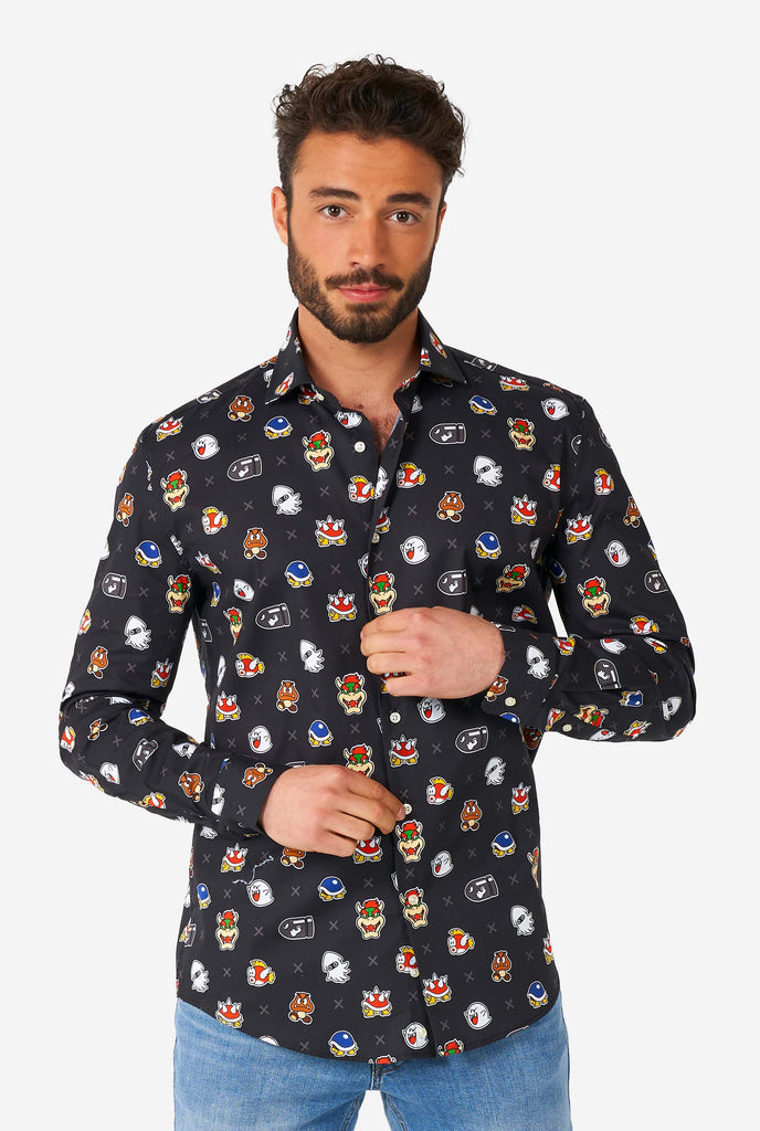 Man wearing black dress shirt with Super Mario bad guys icons