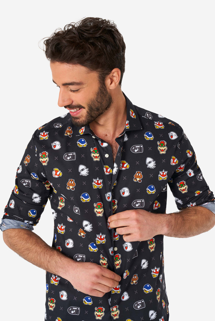 Man wearing black dress shirt with Super Mario bad guys icons