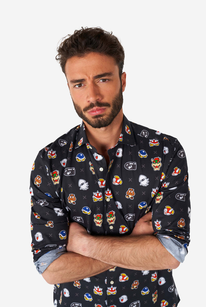 Man wearing black dress shirt with Super Mario bad guys icons