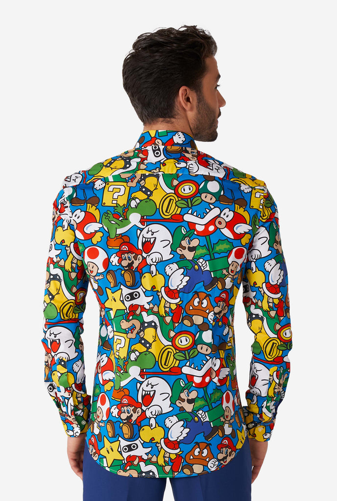 Man wearing dress shirt with Super Mario icons print, view from the back