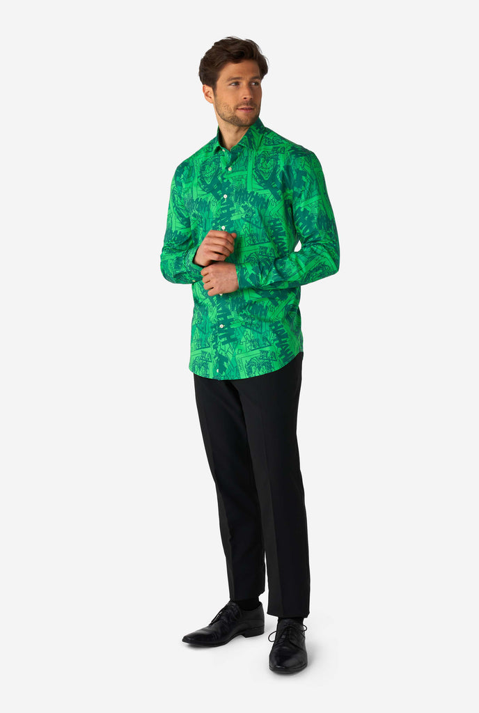 Man wearing green dress shirt with The Joker print