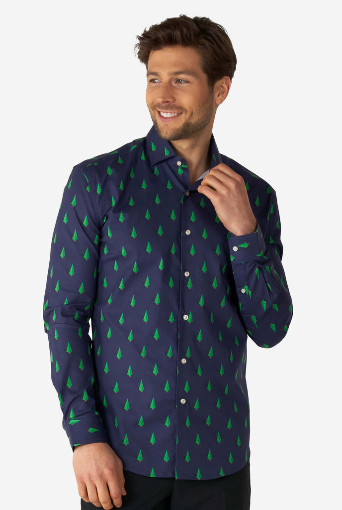 Man wearing blue dress shirt with Christmas tree print