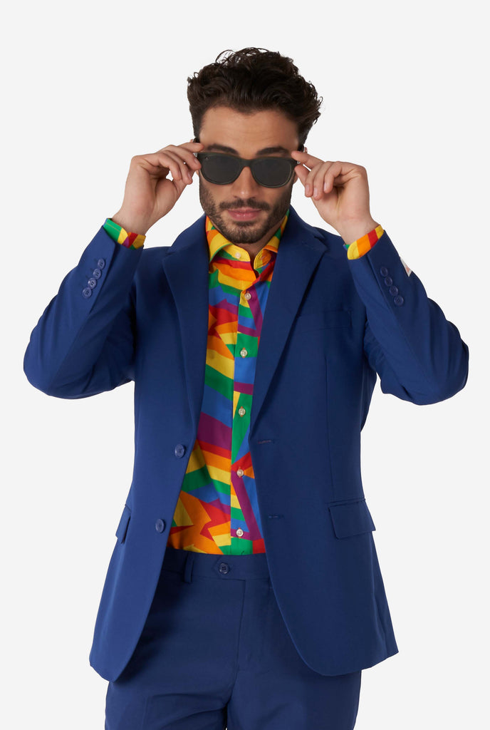 Man wearing colorful rainbow pride dress shirt and blue men's suit