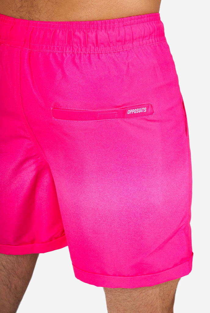 Man wearing pink summer shorts, close-up