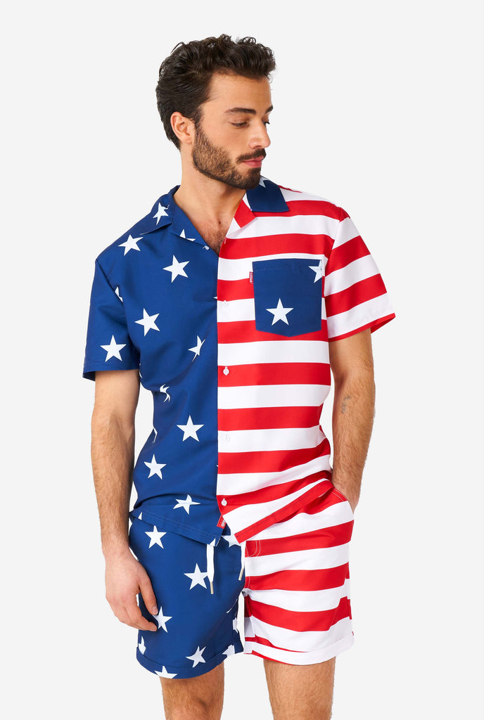 Man wearing summer outfit, consisting of shirt and shorts, with USA flag print