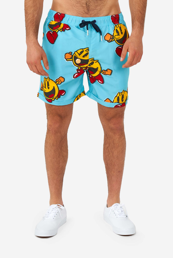 Man wearing blue summer shorts with Pac-Man print