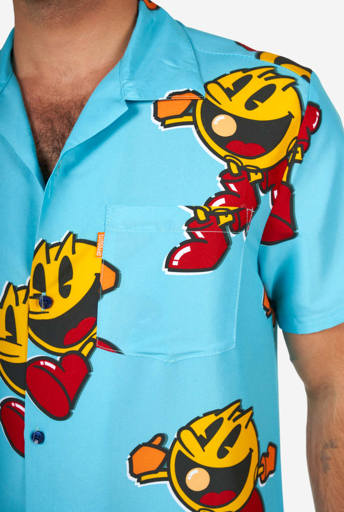 Man wearing blue summer shirt, with Pac-Man print, close up