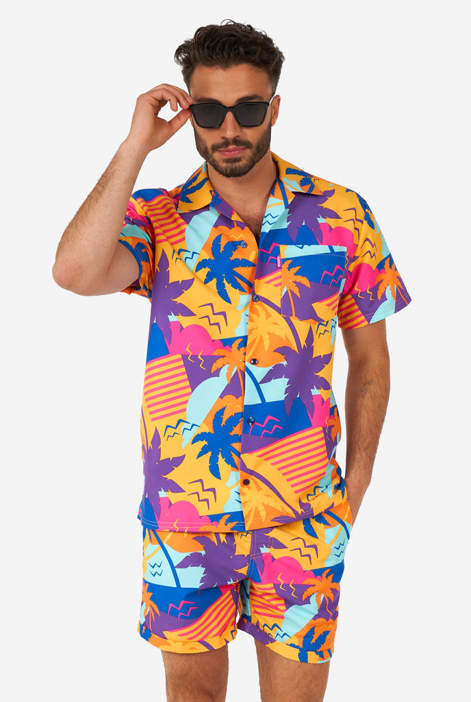 Man wearing colorful summer shorts and shirt