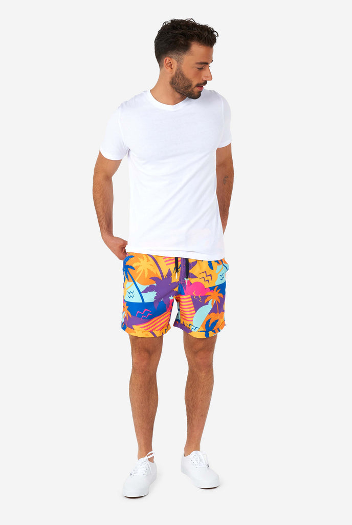 Man wearing colorful summer shorts and shirt