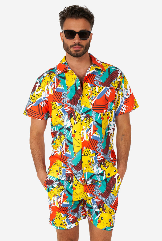 Man wearing colorful summer shorts and shirt with Pikachu Pokemon print